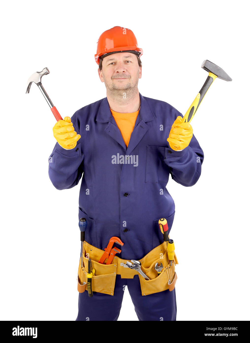 Worker in hard hat holding hammers Stock Photo Alamy