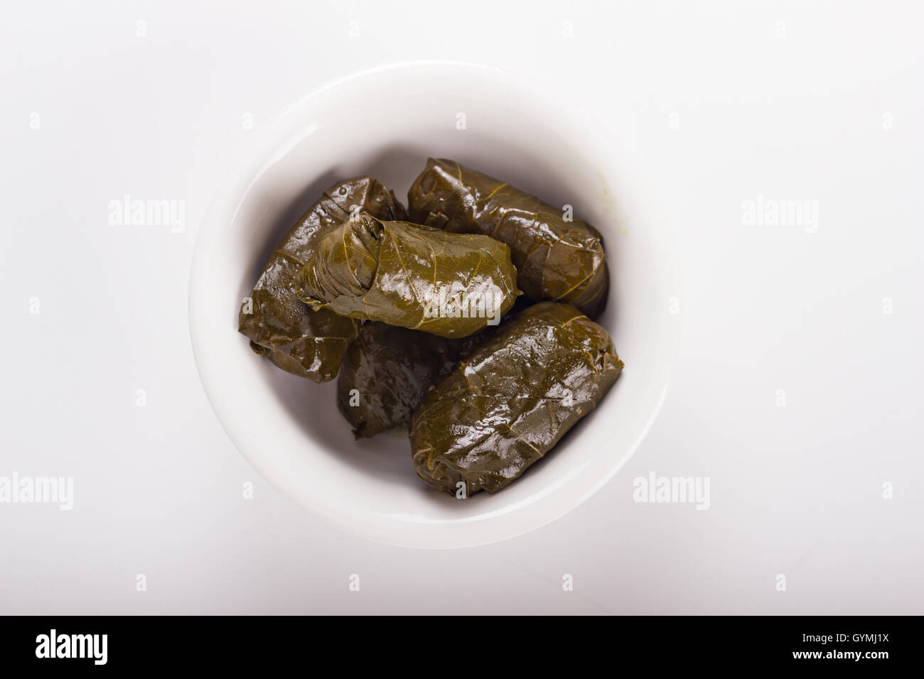 Traditional Greek stuffed vine leaves isolated on white Stock Photo - Alamy
