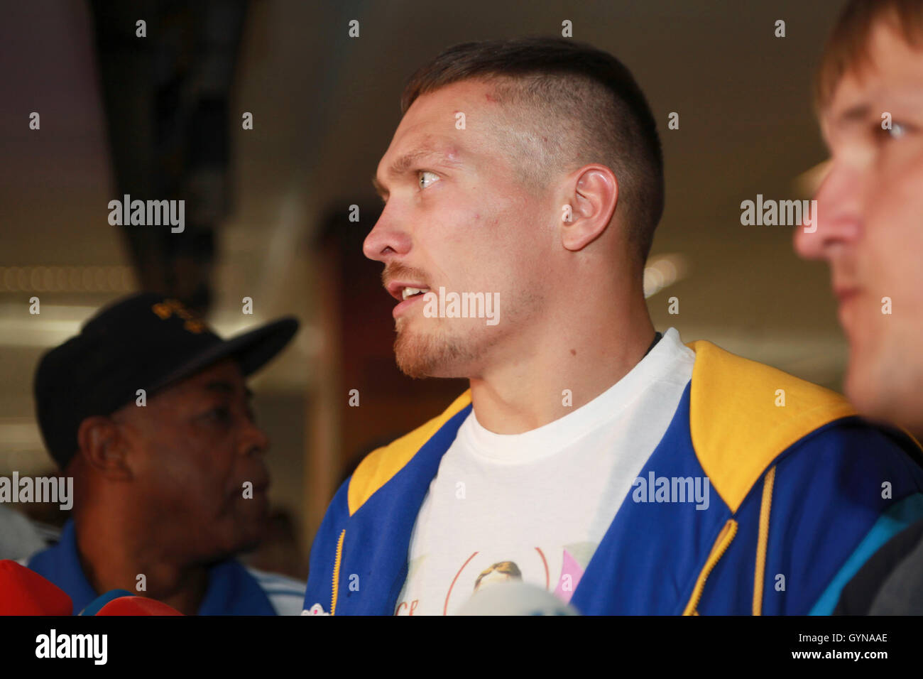 Kiev, Ukraine. 18th Sep, 2016. On 18 September 2016 Ukraine's new WBO Cruiserweight World Champion Alexander Usyk arrived to Kiev from Warsaw after winning against Krzysztof Glowacki in Gdansk on 17 September. Usyk was met like a national hero, with his coach American James Ali Bashir. Usyk stated he would like to start Cruiserweight belts unification from fighting WBC champion Briton Tony Bellew. Stock Photo