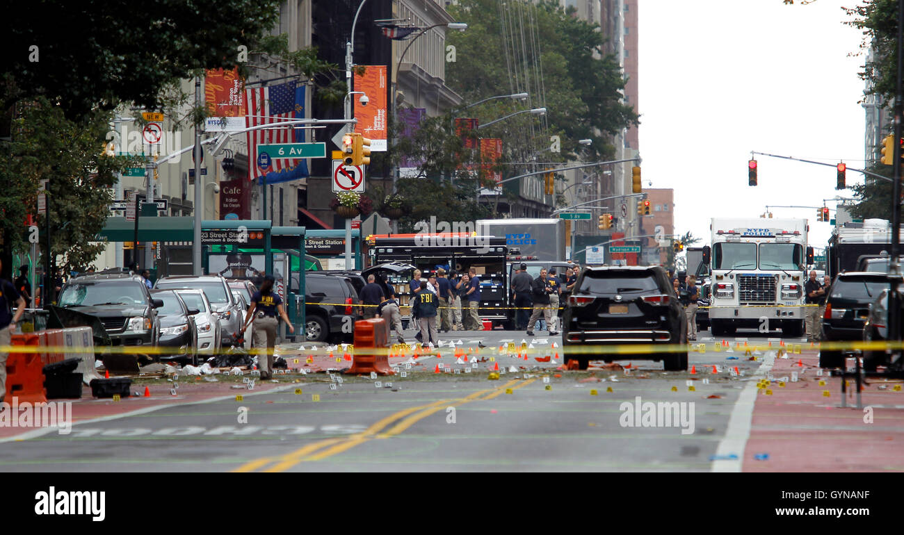 Manhattan, New York, USA.  18th Sep, 2016. Police, and law enforcement personnel from various agencies examine the area for clues the morning after last night's explosion on New York's West 23rd Street between 6th and 7th Avenues in the Chelsea section of Manhattan. the view is looking east on 23rd street from 7th Avenue towards 6th Avenue. The area is marked for clues amidst the debris. 29 people were injured in the blast which has been described by officials as intentional. Credit:  Adam Stoltman/Alamy Live News Stock Photo