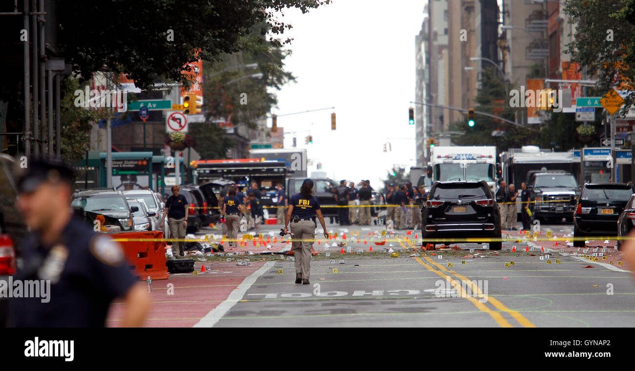 Manhattan, New York, USA.  18th Sep, 2016. Police, and law enforcement personnel from various agencies examine the area for clues the morning after last night's explosion on New York's West 23rd Street between 6th and 7th Avenues in the Chelsea section of Manhattan. the view is looking east on 23rd street from 7th Avenue towards 6th Avenue. The area is marked for clues amidst the debris. 29 people were injured in the blast which has been described by officials as intentional. Credit:  Adam Stoltman/Alamy Live News Stock Photo