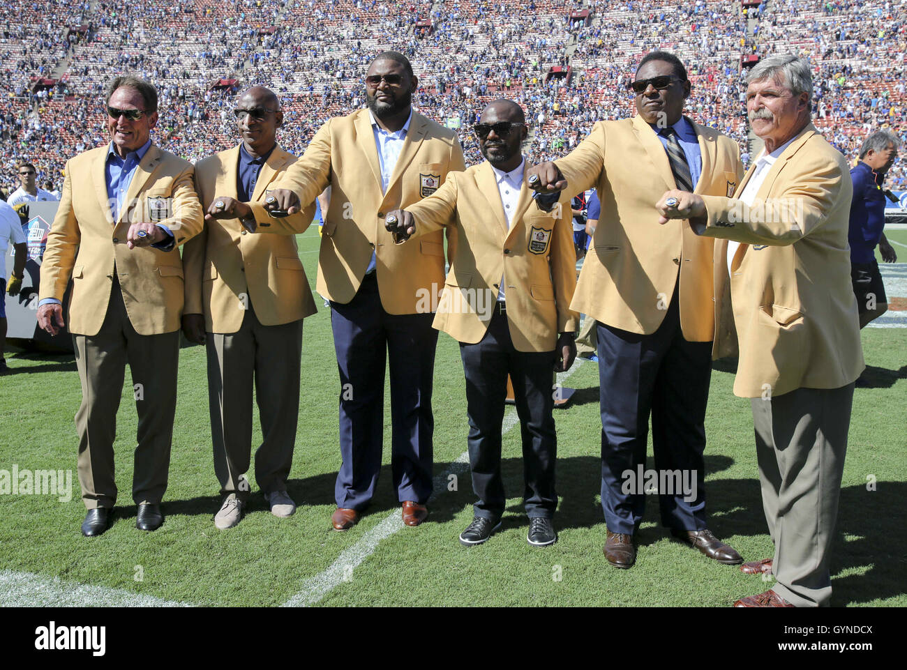 Los Angeles, California, USA. 18th Sep, 2016. Former members of the Rams, from left, Jack Youngblood, Eric Dickerson, Orlando Pace, Marshall Faulk, Jackie Slater, Tom Mack pose during the Rams Hall of Fame Ring of Excellence ceremony at halftime of an NFL football game between the Los Angeles Rams and the Seattle Seahawks at the Los Angeles Memorial Coliseum, Sunday, Sept. 18, 2016, in Los Angeles. Credit:  Ringo Chiu/ZUMA Wire/Alamy Live News Stock Photo