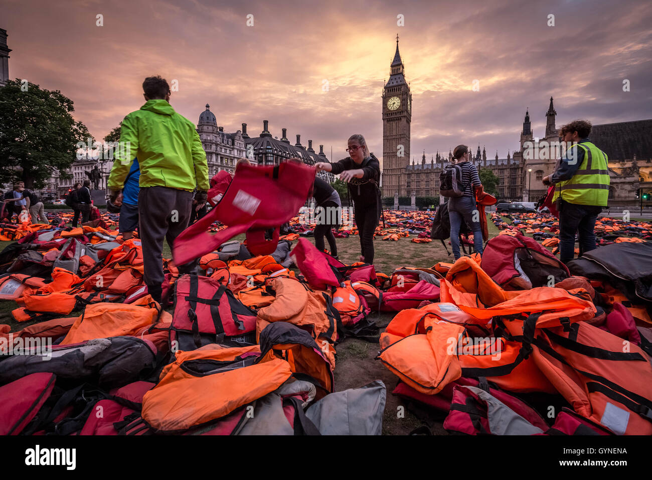 London, UK. 19th September, 2016. ‘Lifejacket Graveyard’ display by refugees and charities in Parliament Square as world leaders meet at United Nations Migration Summit in New York. The lifejackets, many made by people smugglers from cheap non-bouyant materials, were worn by both adult and child refugees who experienced the deadly stretch of sea from Turkey to the Greek island of Chios Credit:  Guy Corbishley/Alamy Live News Stock Photo