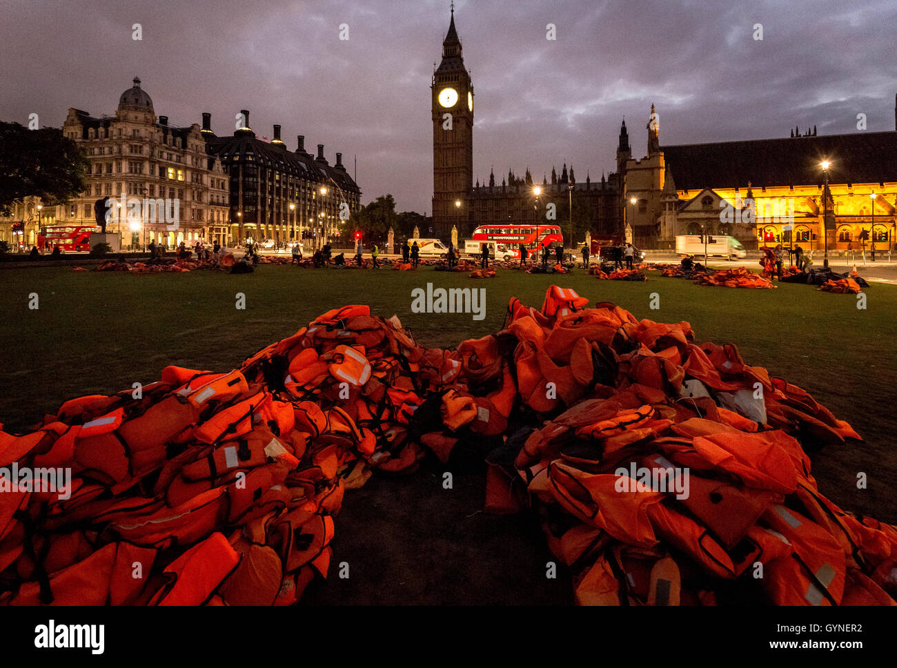 London, UK. 19th September, 2016. ‘Lifejacket Graveyard’ display by refugees and charities in Parliament Square as world leaders meet at United Nations Migration Summit in New York. The lifejackets, many made by people smugglers from cheap non-bouyant materials, were worn by both adult and child refugees who experienced the deadly stretch of sea from Turkey to the Greek island of Chios Credit:  Guy Corbishley/Alamy Live News Stock Photo