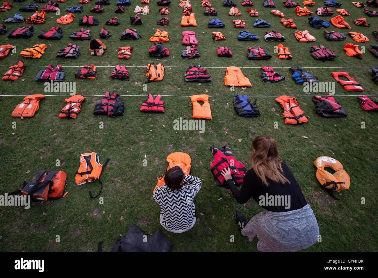 London, UK. 19th September, 2016. ‘Lifejacket Graveyard’ display by refugees and charities in Parliament Square as world leaders meet at United Nations Migration Summit in New York. The lifejackets, many made by people smugglers from cheap non-bouyant materials, were worn by both adult and child refugees who experienced the deadly stretch of sea from Turkey to the Greek island of Chios Credit:  Guy Corbishley/Alamy Live News Stock Photo