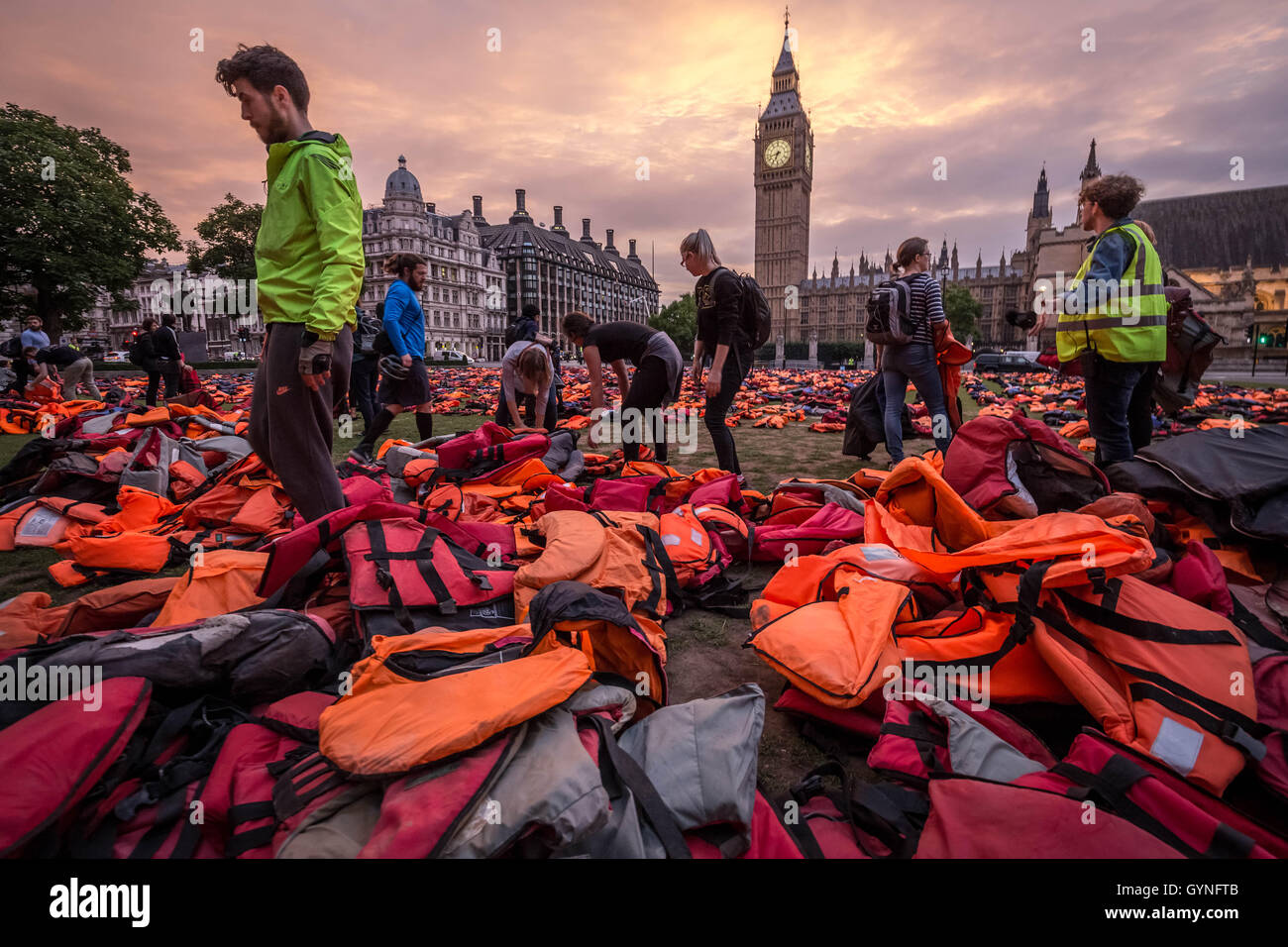 London, UK. 19th September, 2016. ‘Lifejacket Graveyard’ display by refugees and charities in Parliament Square as world leaders meet at United Nations Migration Summit in New York. The lifejackets, many made by people smugglers from cheap non-bouyant materials, were worn by both adult and child refugees who experienced the deadly stretch of sea from Turkey to the Greek island of Chios Credit:  Guy Corbishley/Alamy Live News Stock Photo