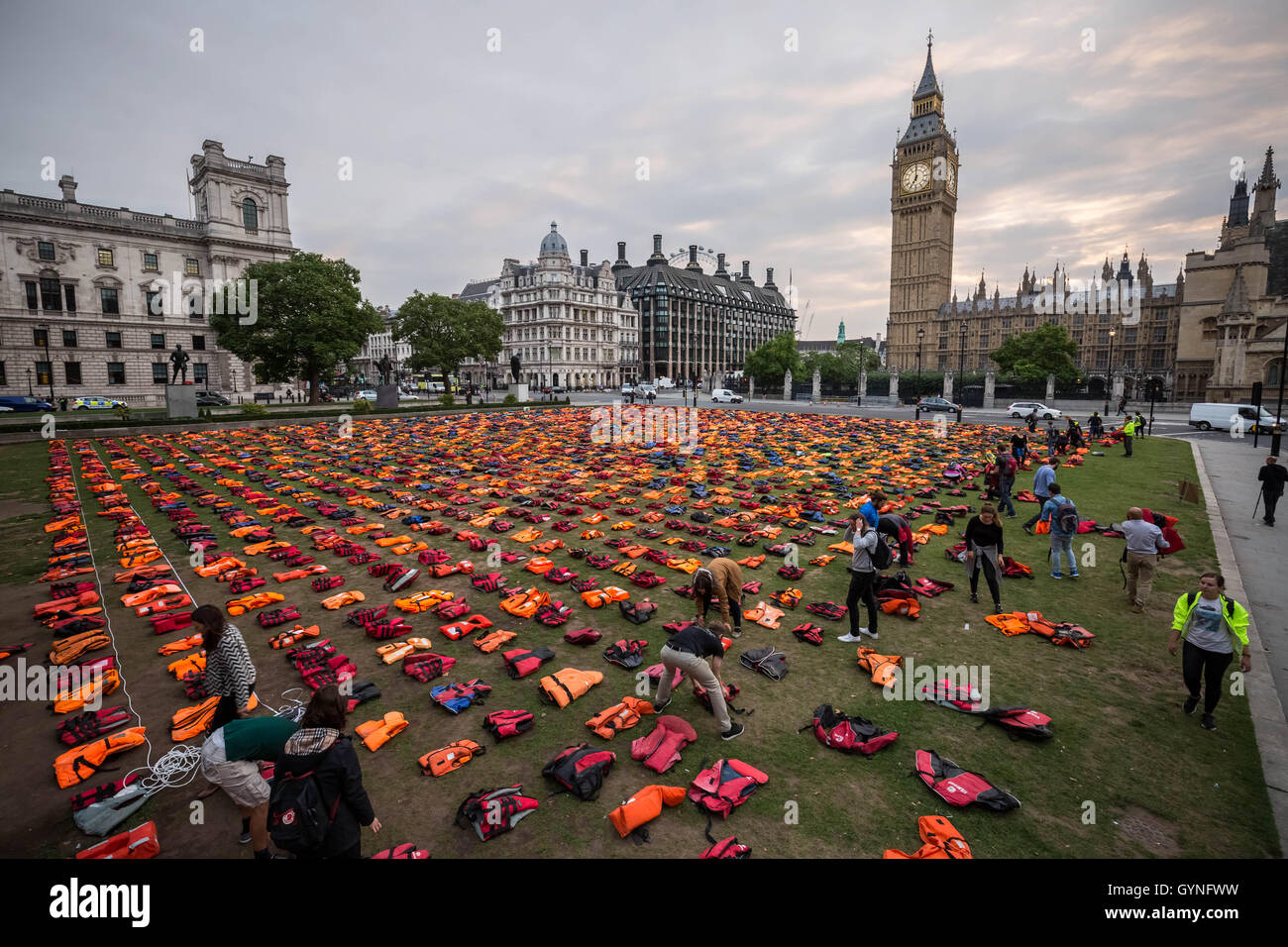 London, UK. 19th September, 2016. ‘Lifejacket Graveyard’ display by refugees and charities in Parliament Square as world leaders meet at United Nations Migration Summit in New York. The lifejackets, many made by people smugglers from cheap non-bouyant materials, were worn by both adult and child refugees who experienced the deadly stretch of sea from Turkey to the Greek island of Chios Credit:  Guy Corbishley/Alamy Live News Stock Photo