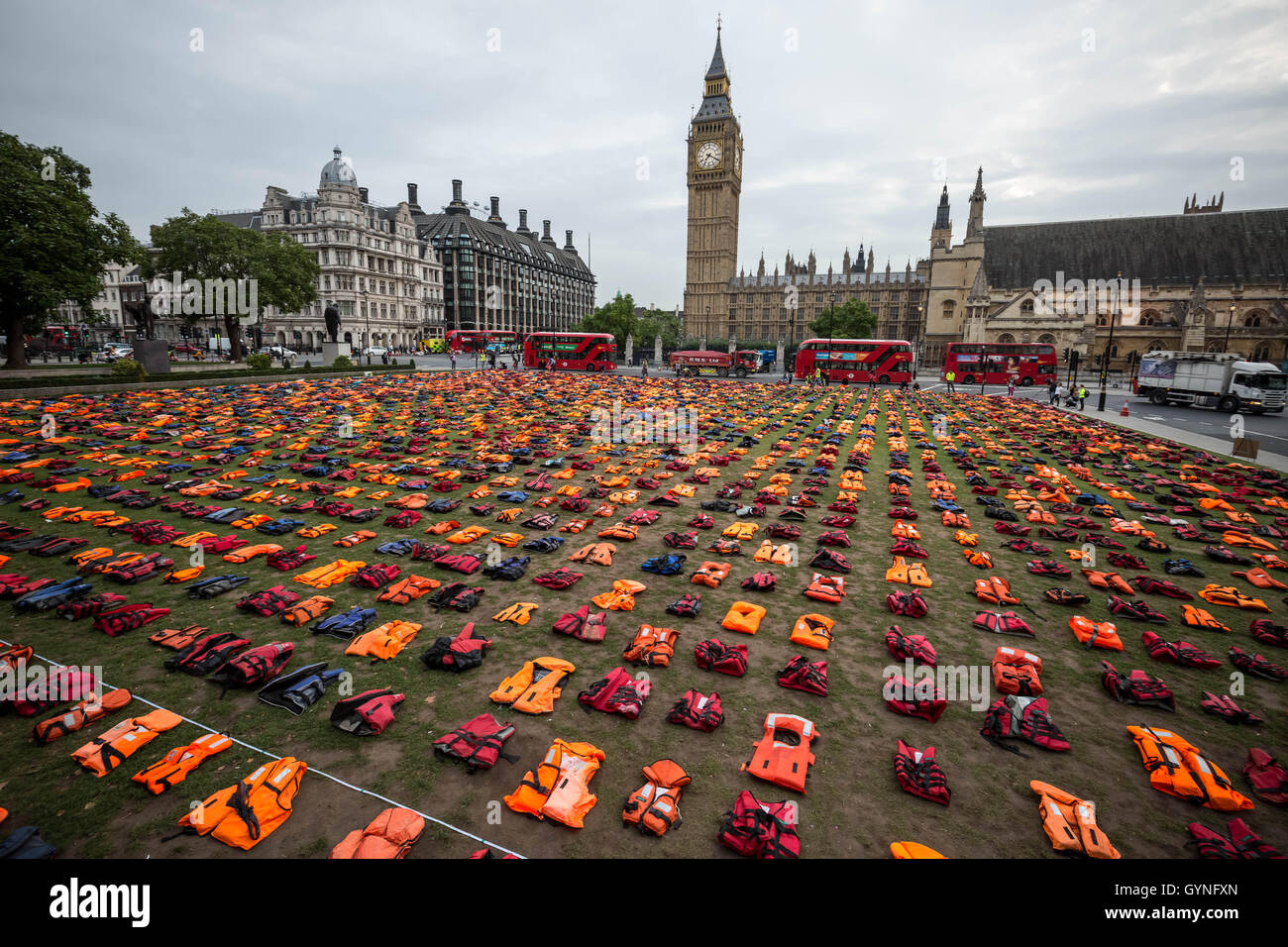 London, UK. 19th September, 2016. ‘Lifejacket Graveyard’ display by refugees and charities in Parliament Square as world leaders meet at United Nations Migration Summit in New York. The lifejackets, many made by people smugglers from cheap non-bouyant materials, were worn by both adult and child refugees who experienced the deadly stretch of sea from Turkey to the Greek island of Chios Credit:  Guy Corbishley/Alamy Live News Stock Photo