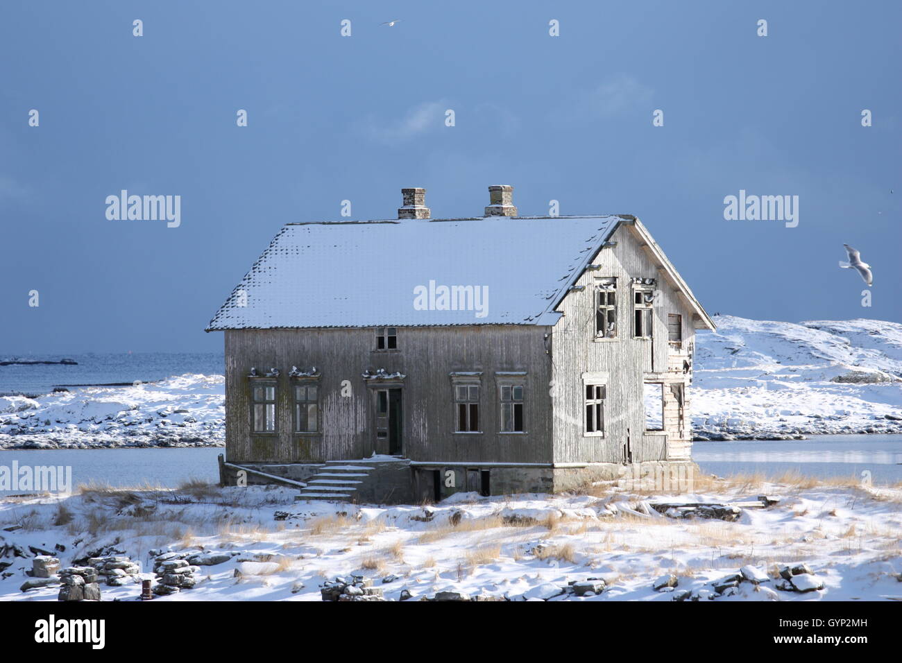 Abandoned old wooden house in snowy Røst, the outermost island in Lofoten, Norway. Stock Photo
