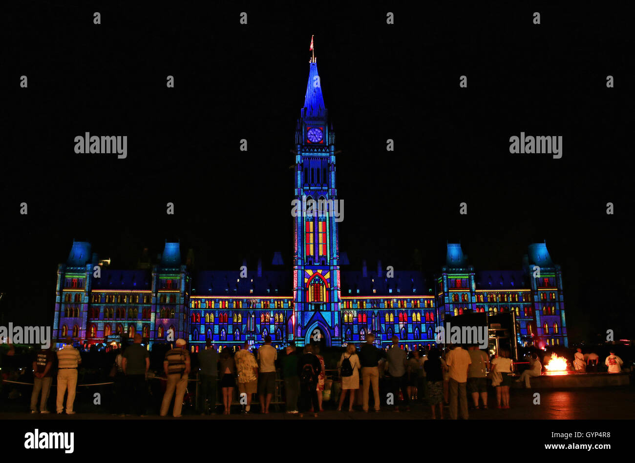 People watching Northern Lights, an illuminated light show sponsored by Government of Canada and Manulife on Parliament Hill, Ot Stock Photo