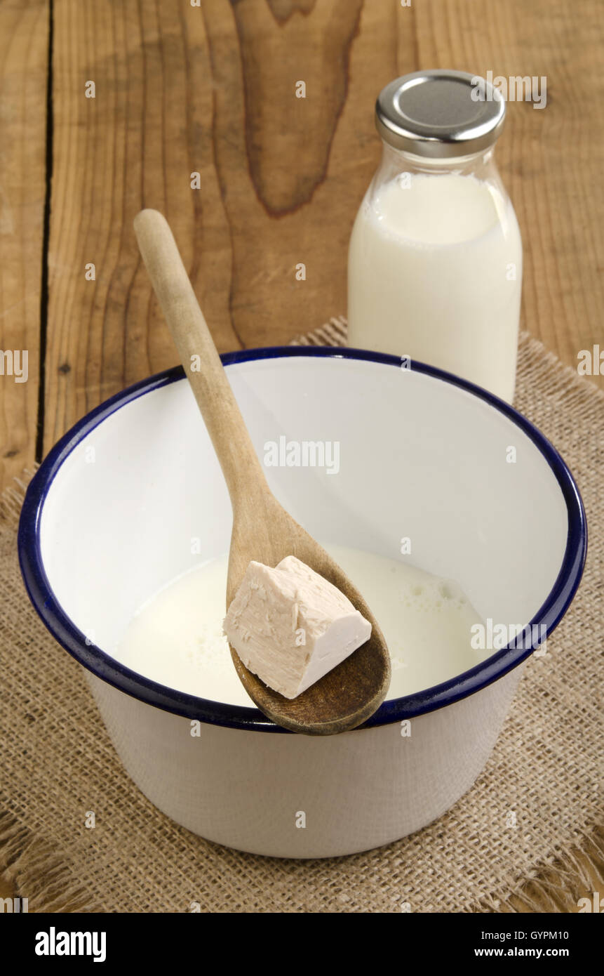 fresh yeast is added to milk Stock Photo Alamy