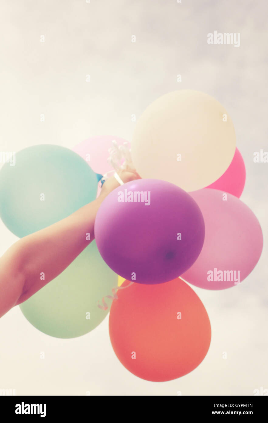 Holding balloon vintage hi-res stock photography and images - Alamy