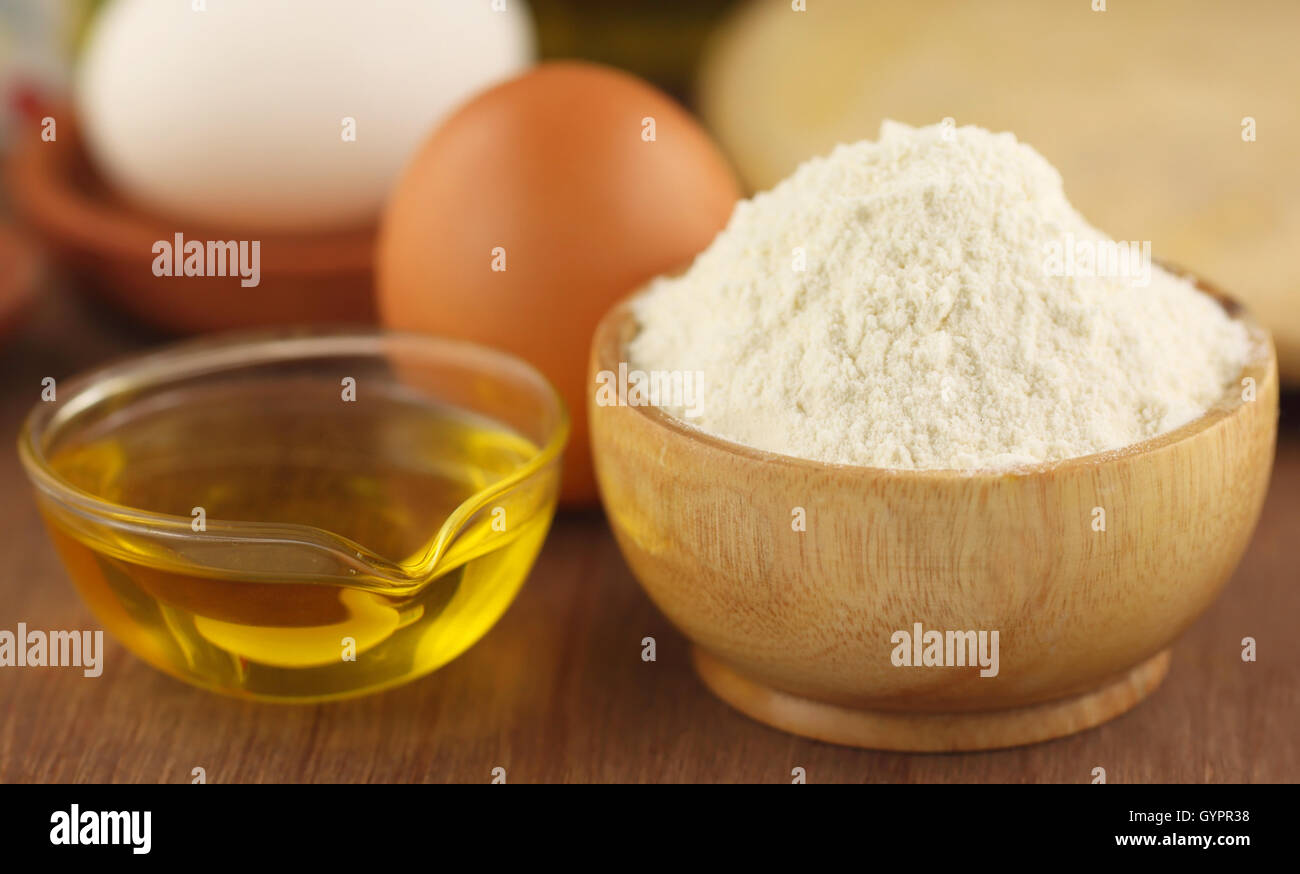 Flour with eggs and cooking oil Stock Photo