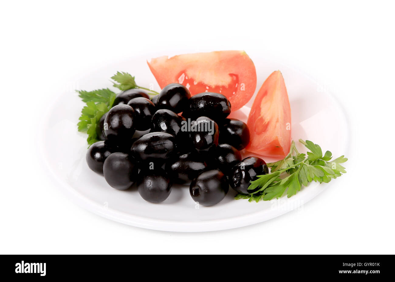 Black olives with tomatoes and parsley Stock Photo Alamy