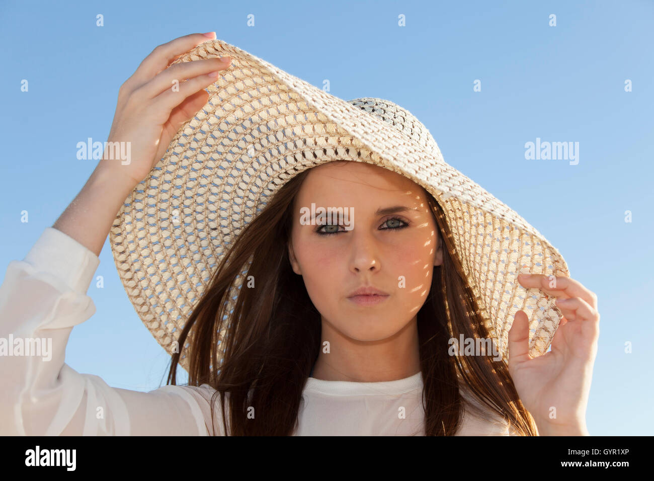 Happy woman beach hat hires stock photography and images Alamy