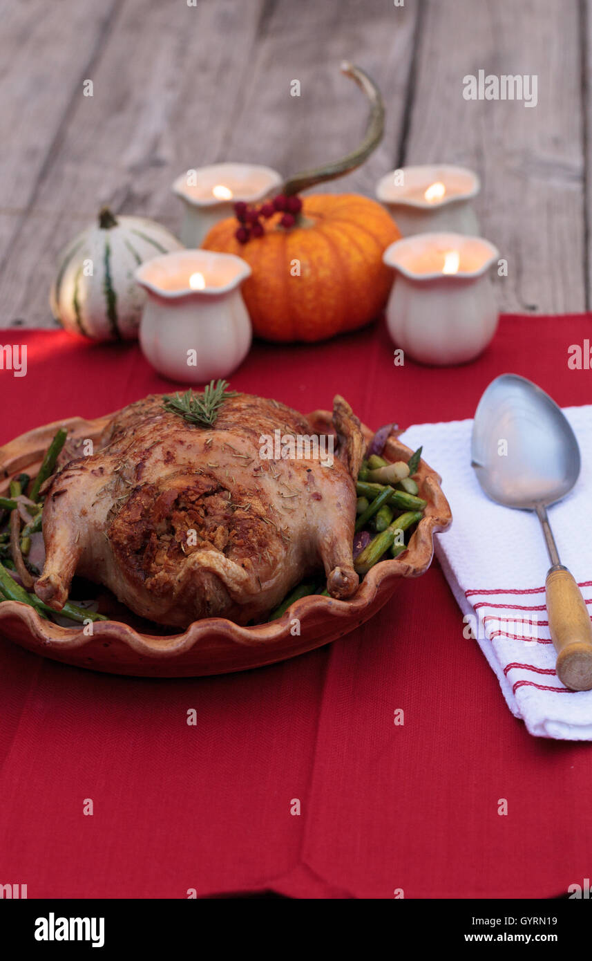 Rosemary roasted duck stuffed with bread stuffing and ringed with