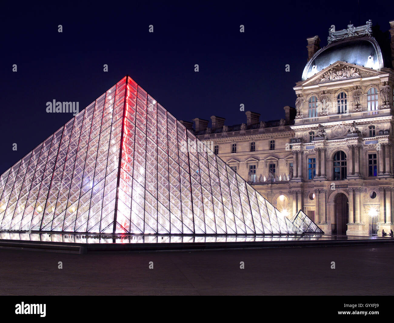 Louvre Pyramid (Pyramide du Louvre) at Louvre Museum, Paris, France, at night Stock Photo