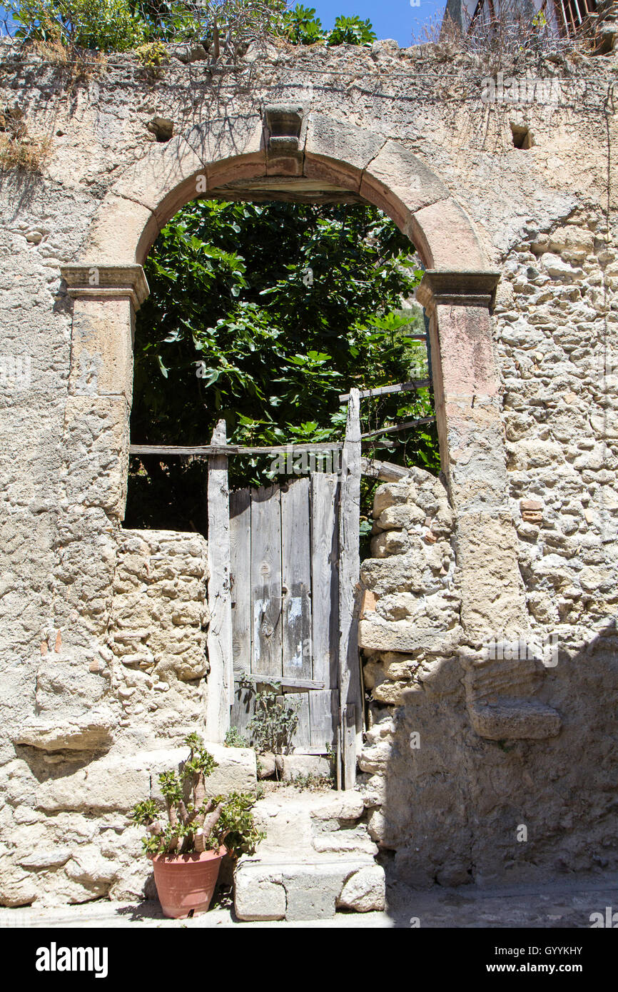 ancient wooden door of the house in ruins, Amantea Italy Stock Photo