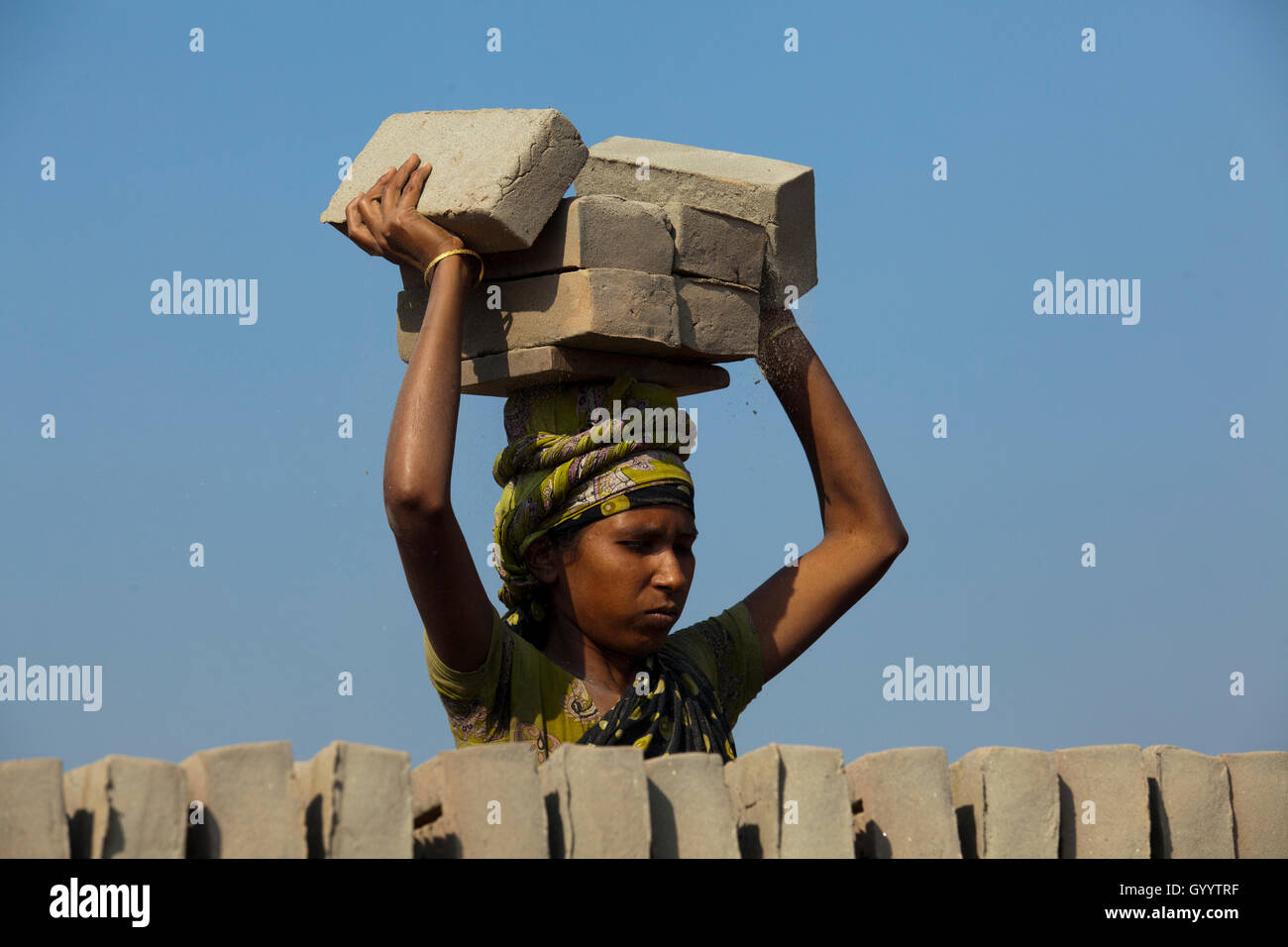 Female labourer works at brickfield at Amin Bazar. Dhaka, Bangladesh