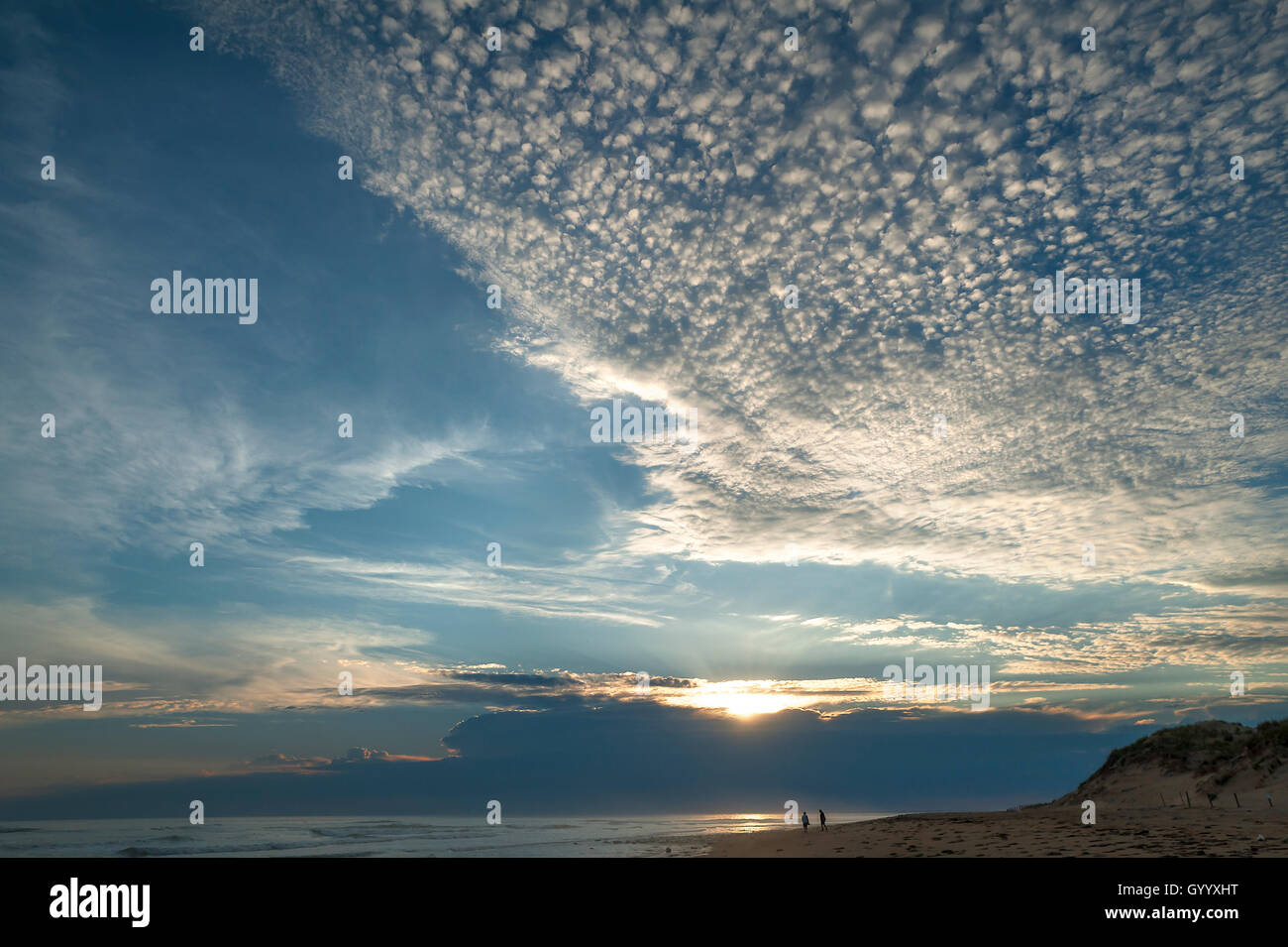 Sunset with small cirrocumulus clouds, herringbone sky, by the Atlantic coast, La Tranche sur Mer Vandee, France Stock Photo