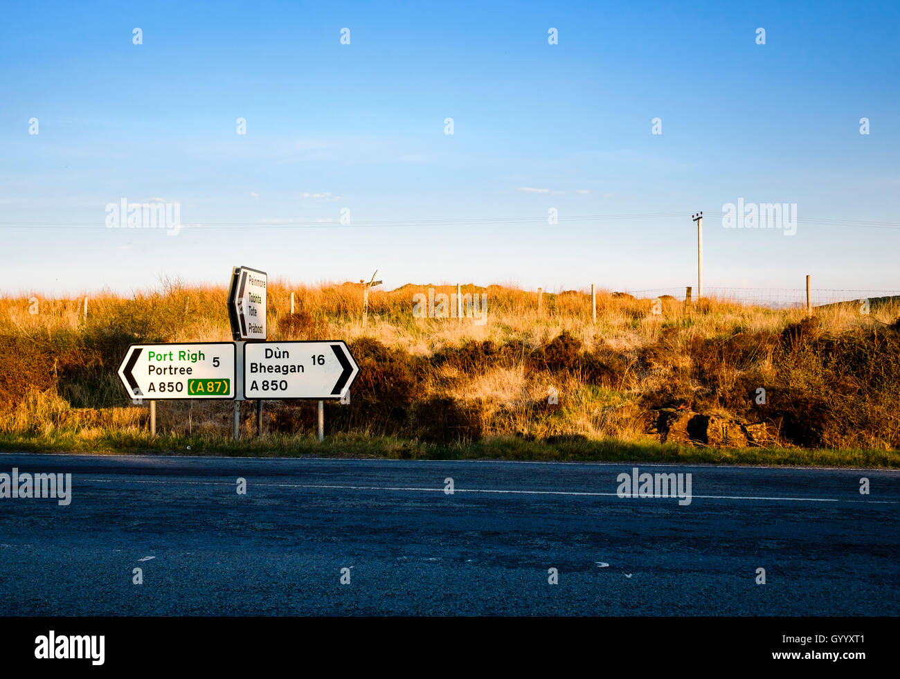 Signpost on a road in the evening light, Skeabost, Isle of Skye, Highland, Scotland, United Kingdom Stock Photo