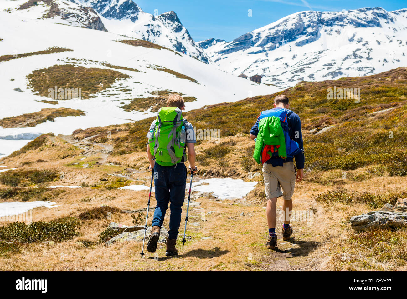 Two hikers on trail, snow melt, Rohrmoos-Untertal, Schladming Tauern, Schladming, Styria, Austria Stock Photo