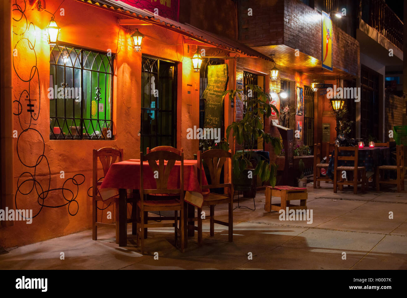 Cozy bar and restaurant in Huaraz, Peru, South America at night Stock Photo