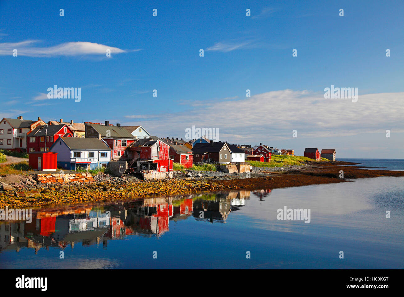 fisherman's cottages reflecting in the sea, Norway, Varanger Peninsula, Vardo Stock Photo