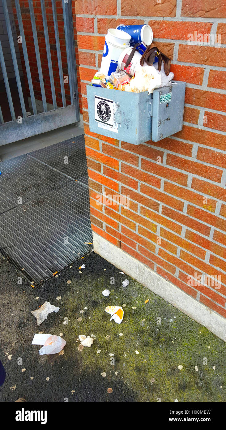 overfull waste bin at a wall, Germany Stock Photo - Alamy