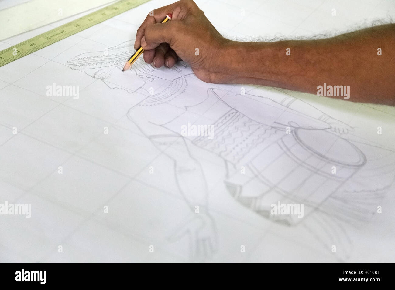 COLOMBO, SRI LANKA - MARCH 12, 2014: Local man drawing batik designs. The manufacture and export of textile products is one of t Stock Photo