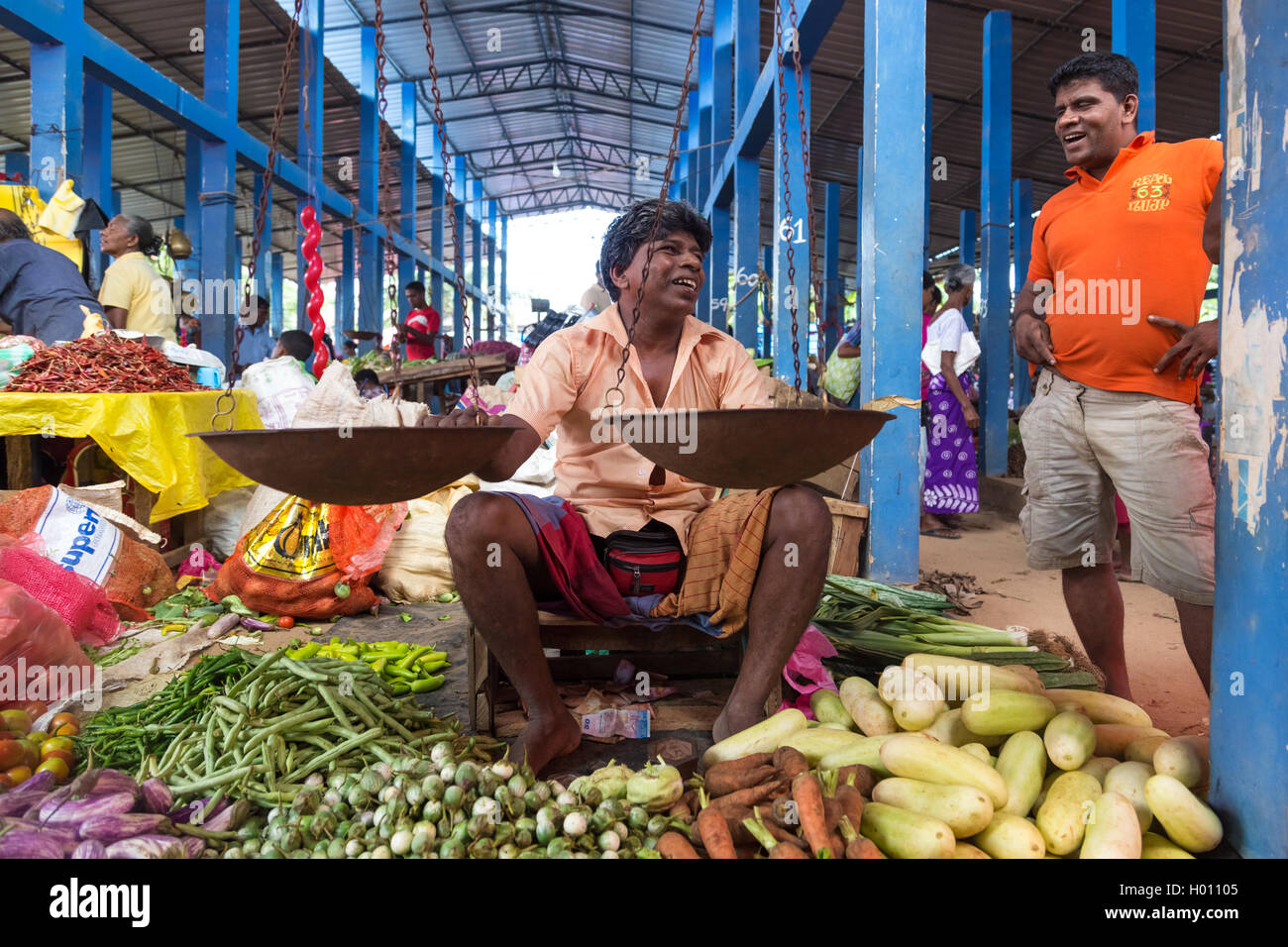 Young man selling vegetables hi-res stock photography and images - Alamy