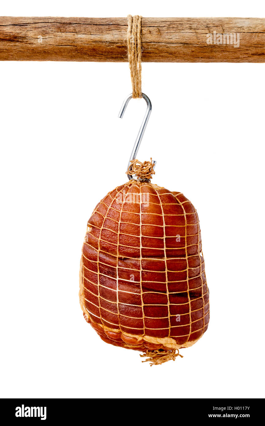 Smoked boneless pork ham hock wrapped in netting hanging on a hook from