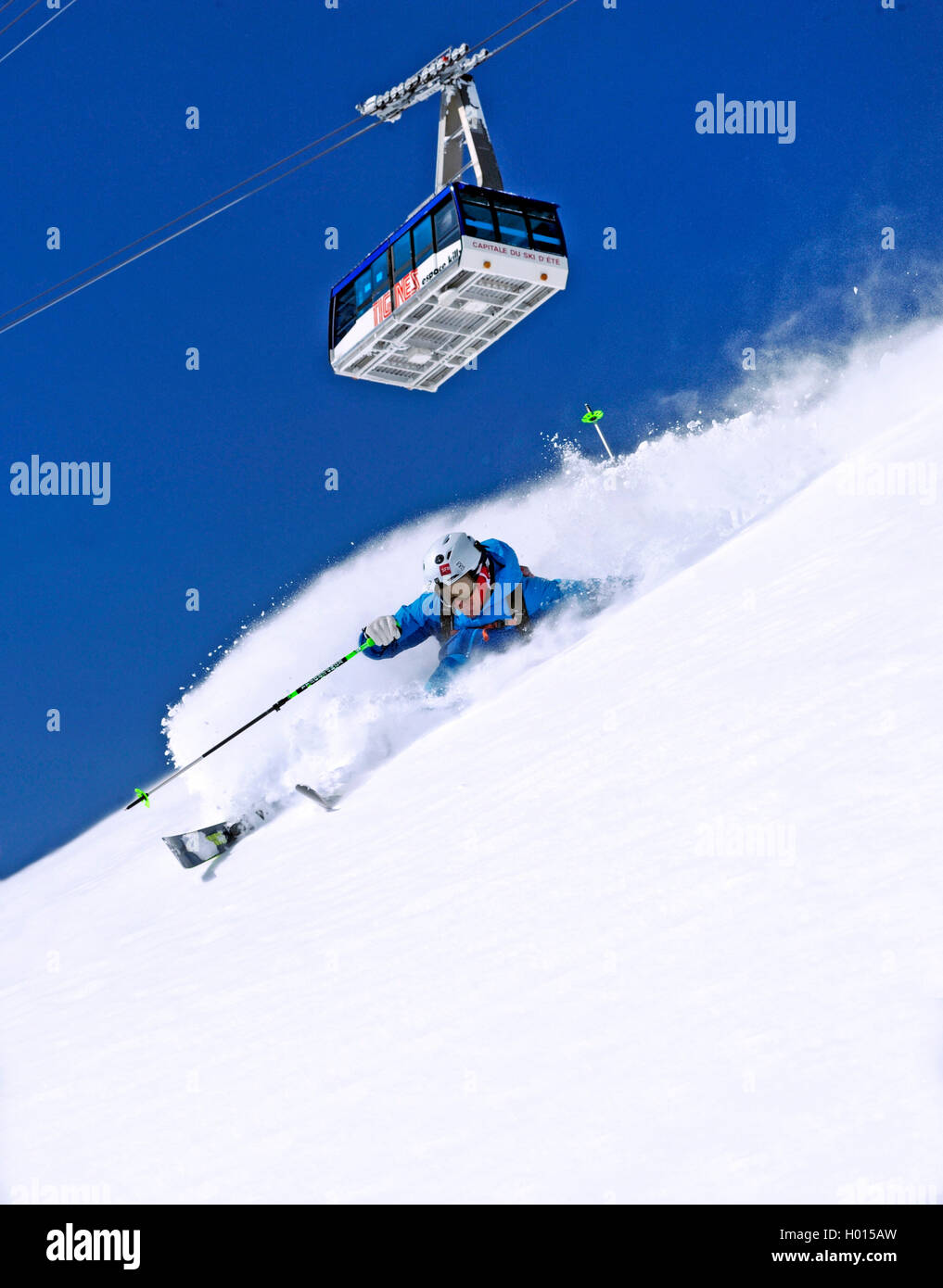 skier and cable car of Grande Motte, France, Savoie, Tignes Stock Photo