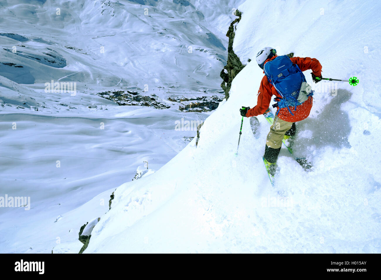 freerider on steep slope, ski resort of Val Thorens in background, France, Savoie, Val Thorens Stock Photo