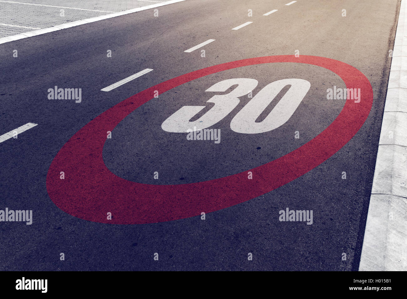 30 kmph or mph driving speed limit sign on highway, road safety and preventing traffic accident concept. Stock Photo
