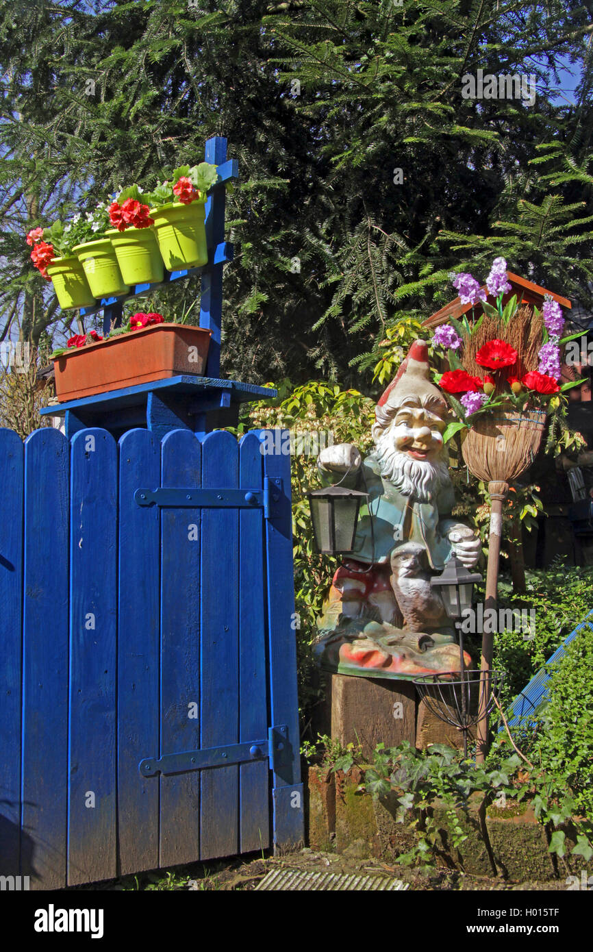 garden with garden gnome in the style of the old days, trashy, Germany