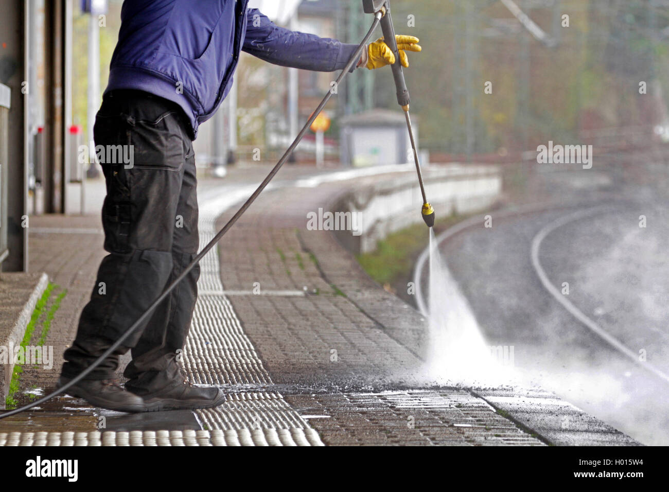 cleaning ways with pressure washer, Germany Stock Photo