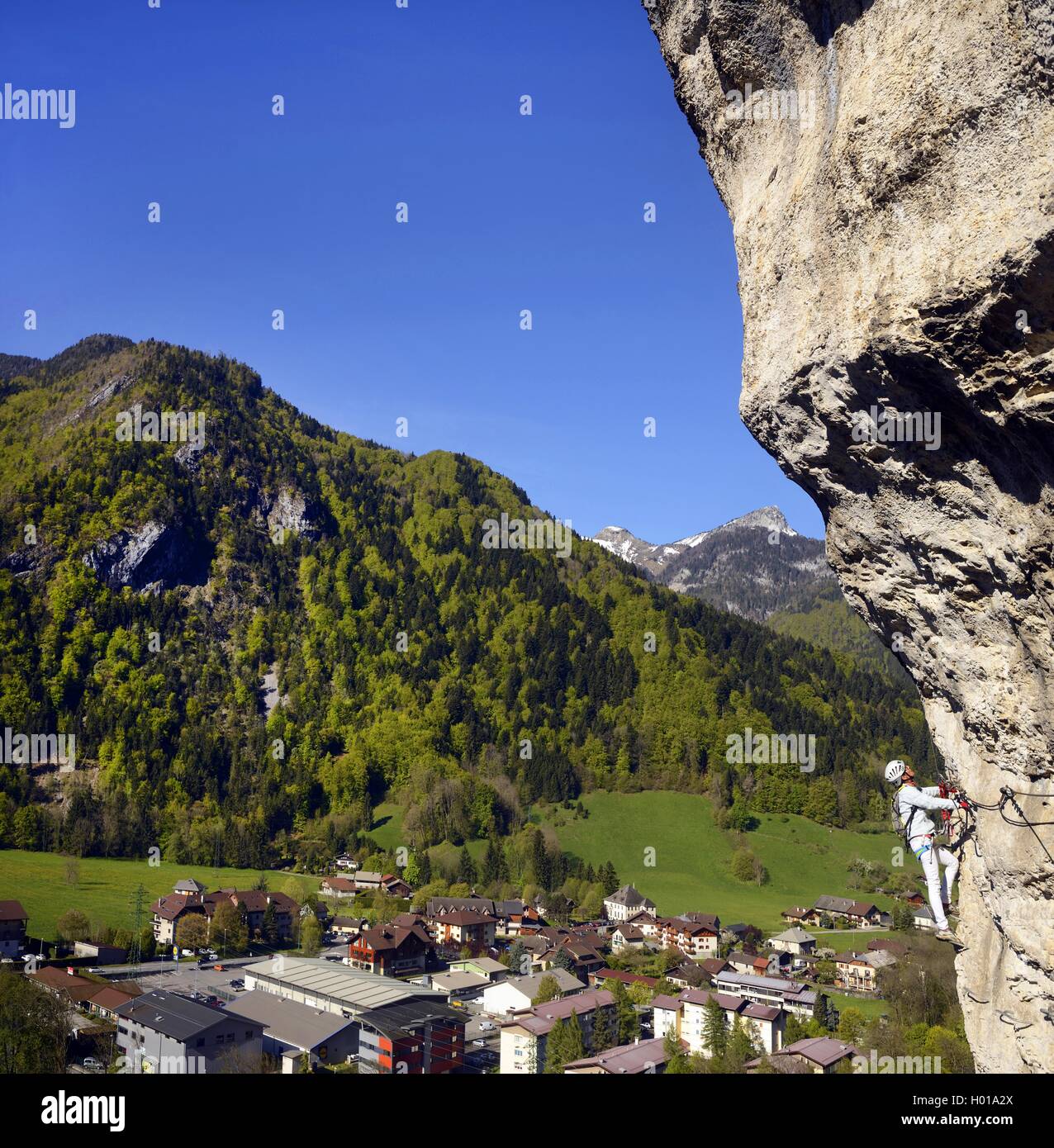 climber on rock face, Via ferrata de Thones, La Roche a l┤Agathe, France, Haute-Savoie Stock Photo