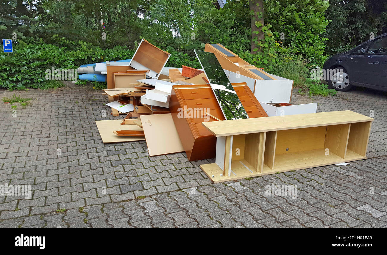 illegal disposed bulky waste on a parking place, Germany Stock Photo
