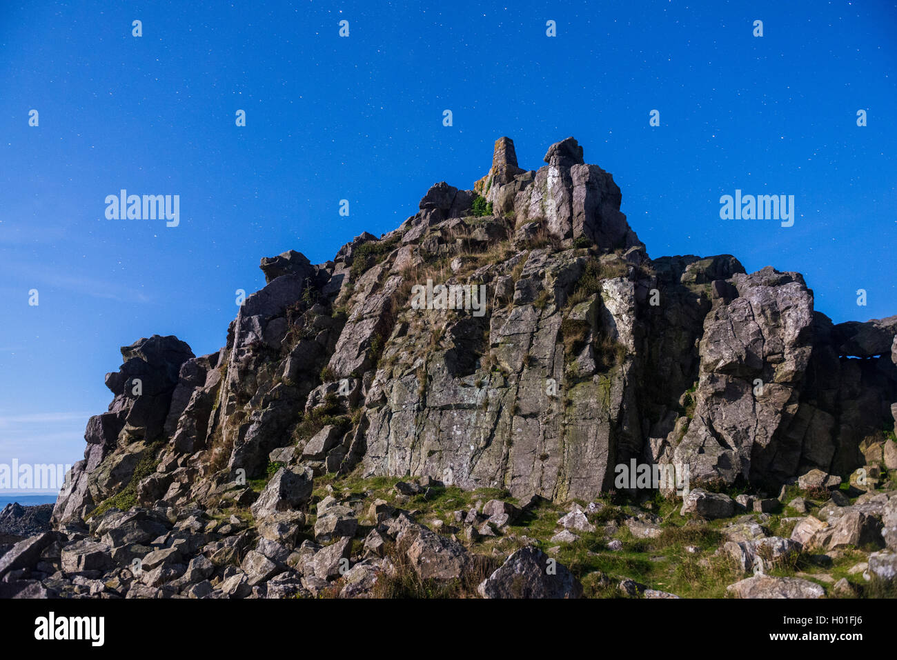 Manstone Rock on the Stiperstones illuminated by moonlight in Shropshire, England, UK. Stock Photo