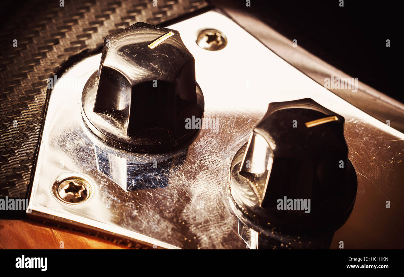 Closeup view on knobs for volume and tone control of a jazz bass guitar Stock Photo Alamy