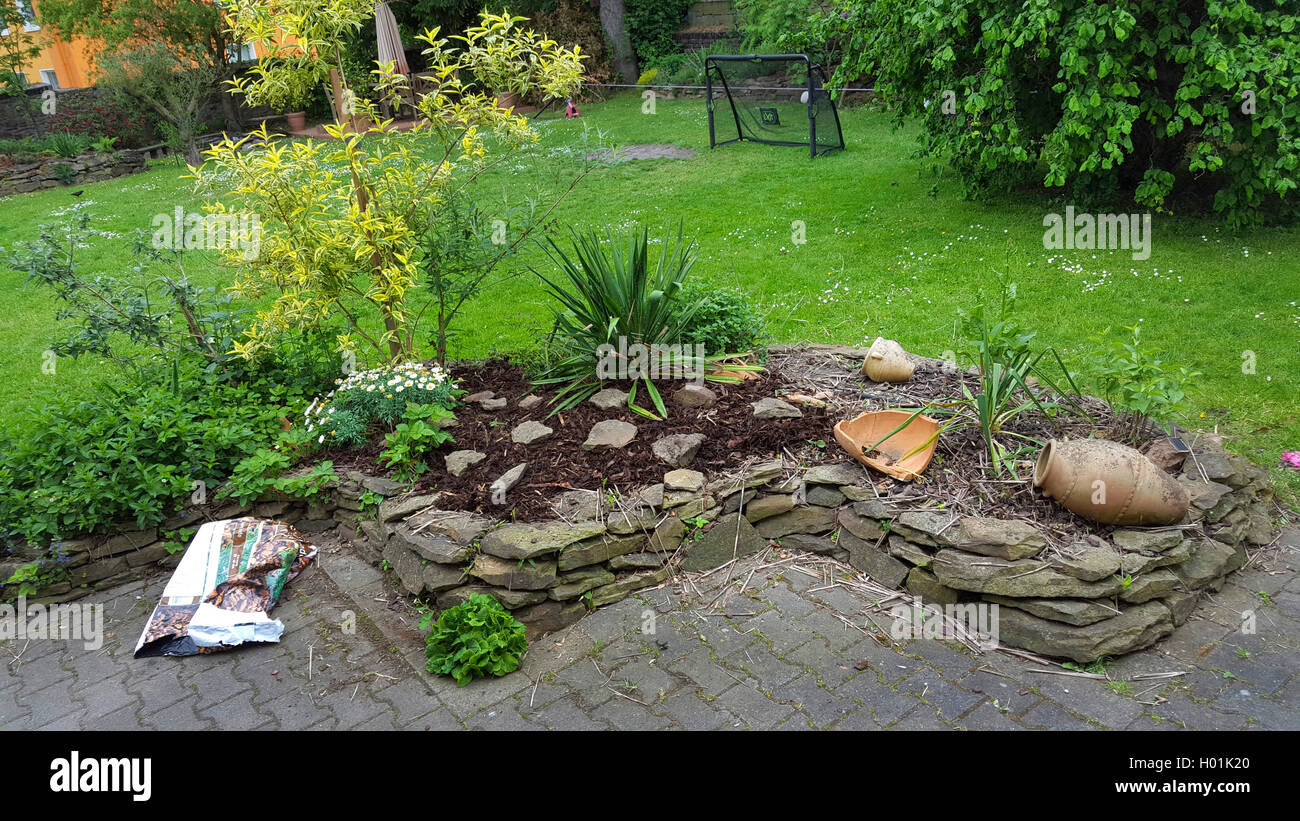 spice plants bed with natural stone wall in a garden , Germany, North Rhine-Westphalia, Ruhr Area, Witten Stock Photo