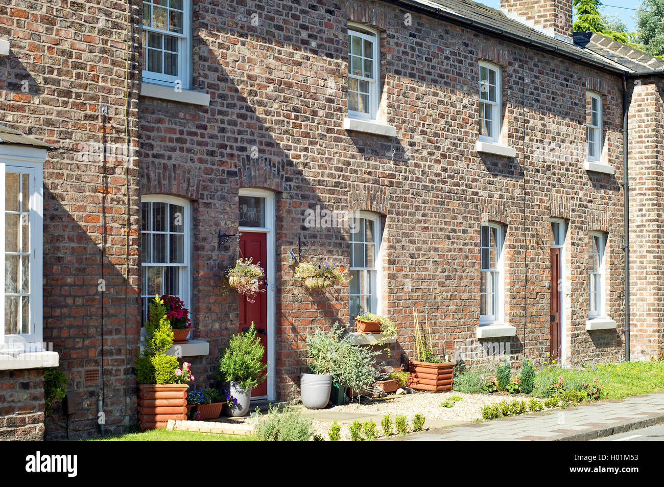 Attractive brick built cottages,Bromborough Pool Garden Stock Photo Alamy