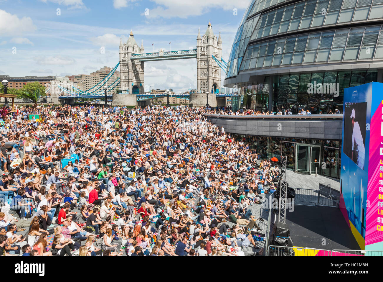 England, London, Southwark, Crowds at The Scoop Open Air Theatre and The Tower of London Stock Photo