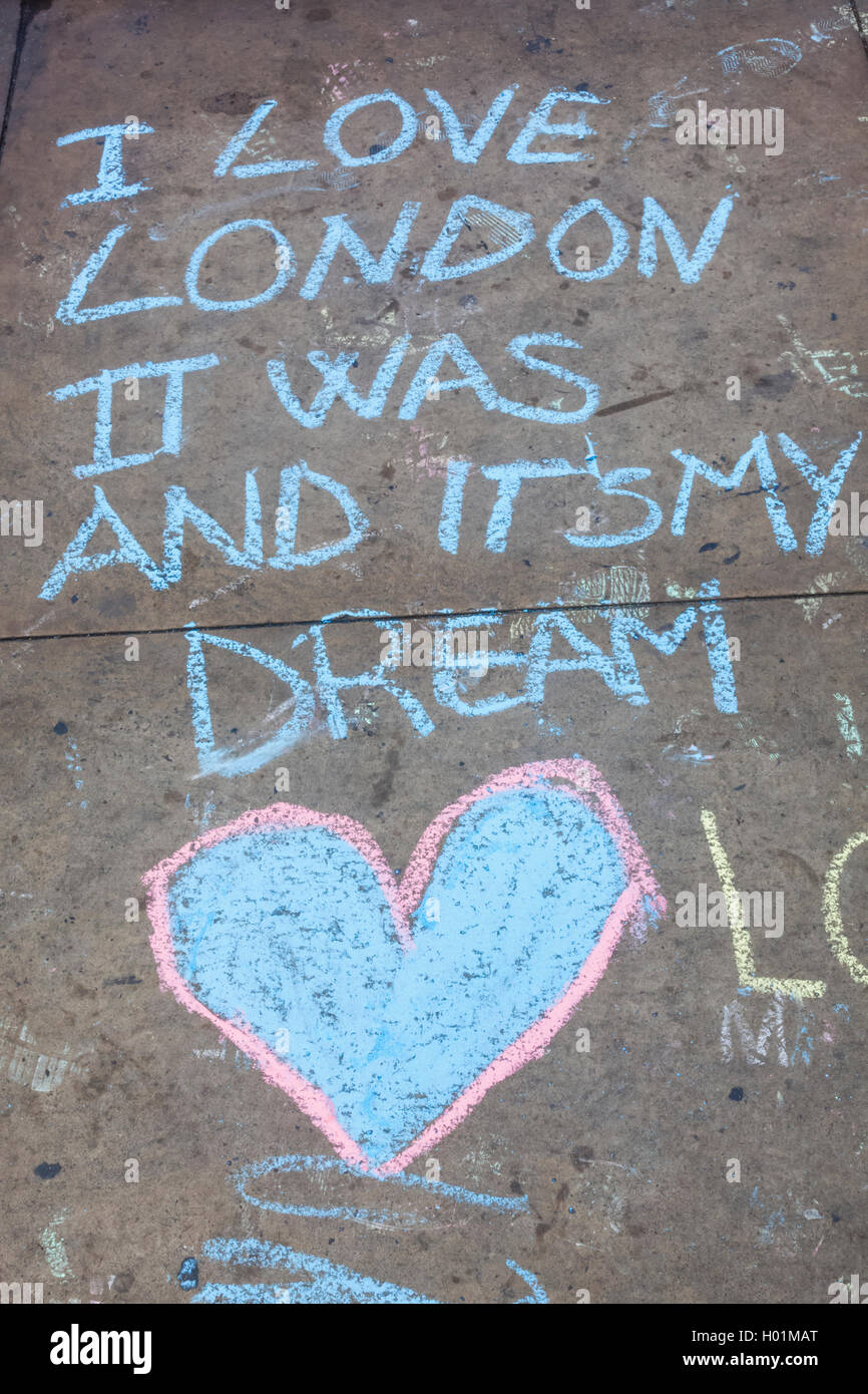 england london piccadilly circus chalk writing on pavement stock
