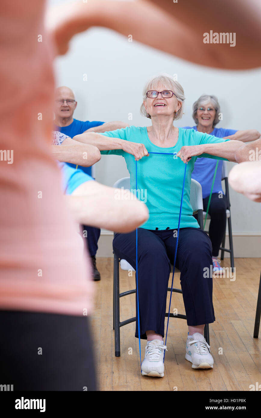 Group Of Seniors Using Resistance Bands In Fitness Class Stock Photo
