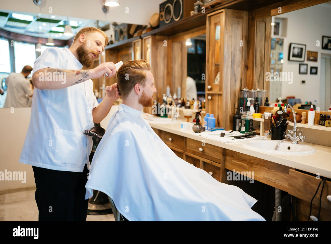 Hair beard and mustache treatment in barber shop Stock Photo Alamy