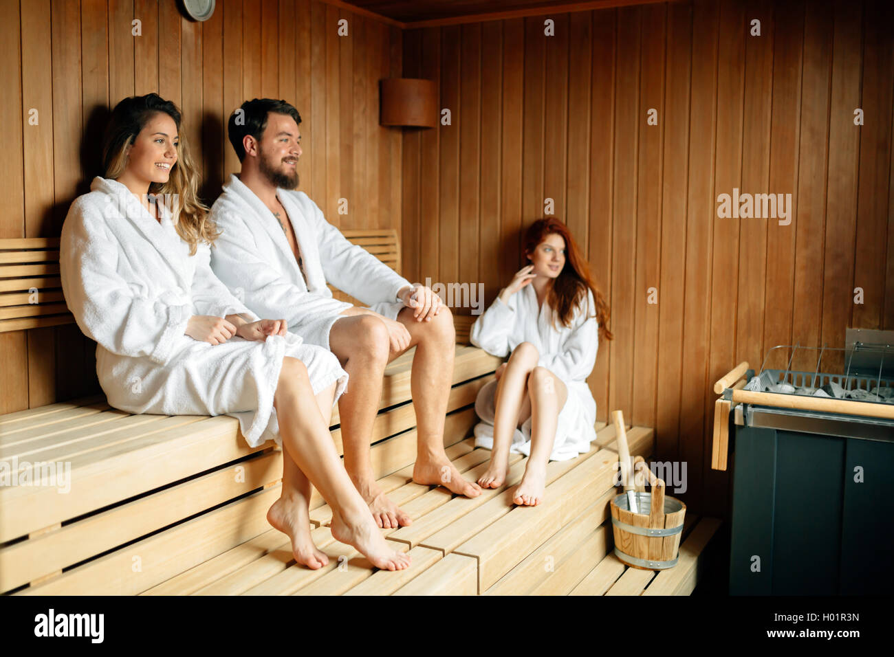 People in sauna relaxing and staying healthy Stock Photo