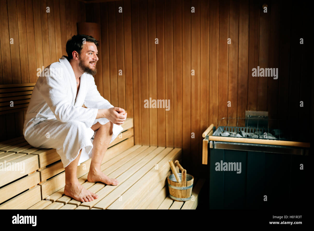 Healthy male in sauna relaxing and enjoying wellness weekend Stock