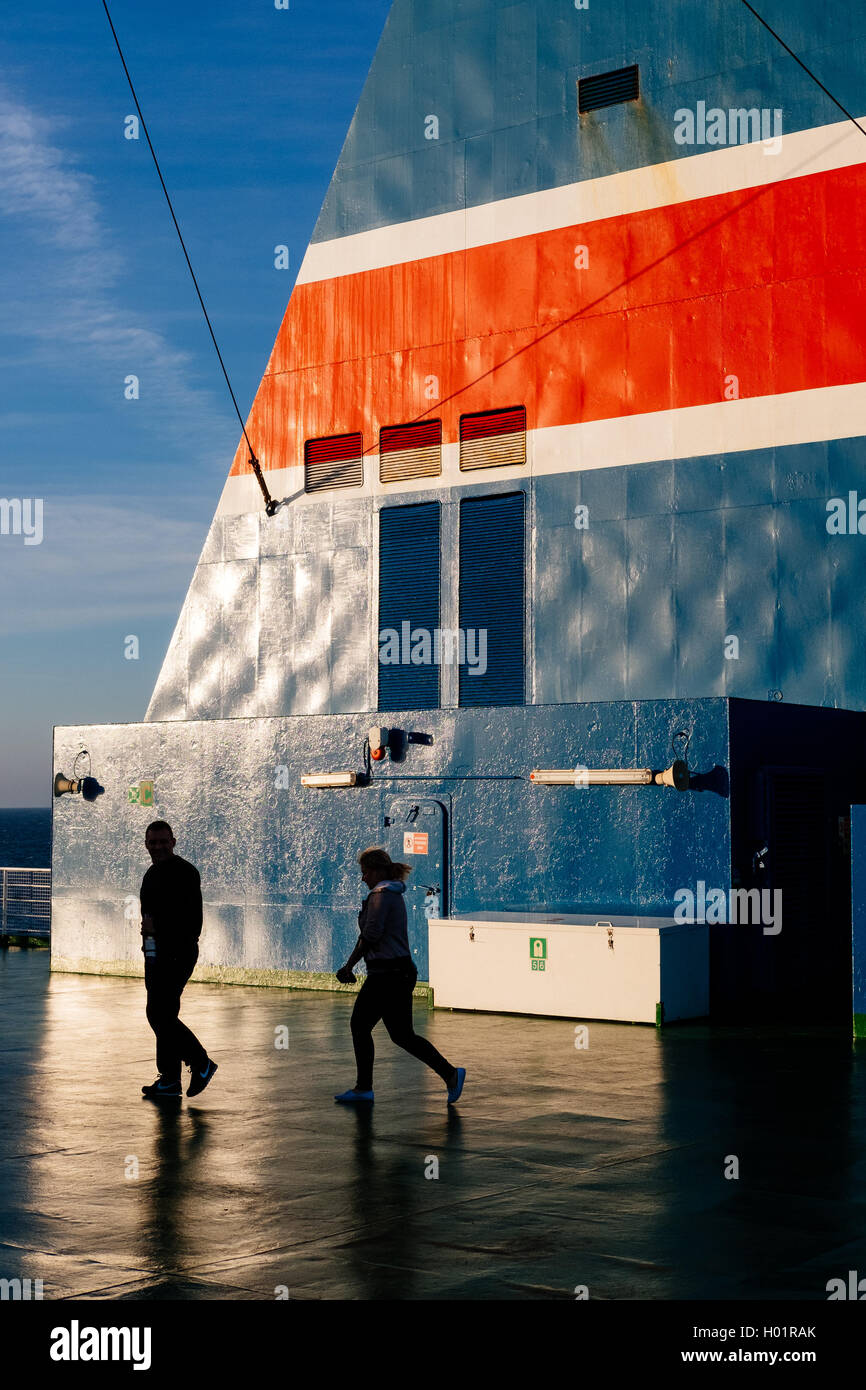 Man and woman on a Baltic sea ferry deck traveling from Poland to Scandinavia Stock Photo